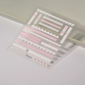 Detail shot of 5D pink and white lace bow nail art stickers with embossed patterns