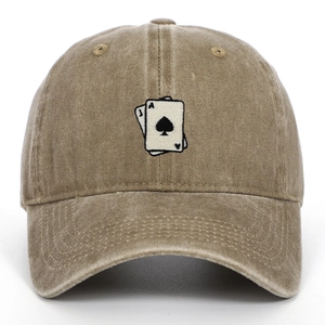 Close-up of Ace of Spades embroidery on washed khaki cotton vintage baseball cap