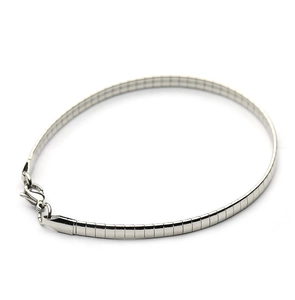 Detailed view of silver mesh snake chain bracelet with polished lobster clasp closure