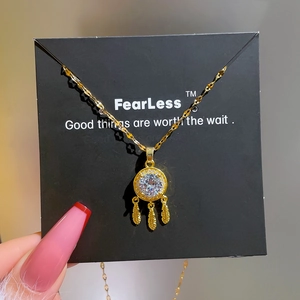 Titanium steel dreamcatcher necklace with feathers and zircon on a display card