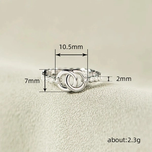 Elegant silver interlocking double ring with sparkling micro-pave zircon crystals