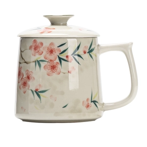 Hand-painted ceramic tea mug with peach blossom pattern, matching lid and handle