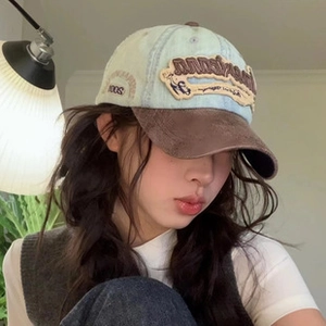 Detailed embroidery on a vintage washed denim baseball cap with heart and Louisiana letters