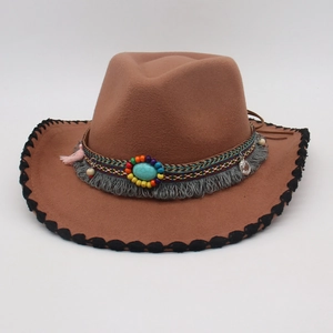 Detail of brown wool felt hat with turquoise stone and ethnic bohemian tassels