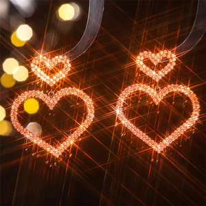 Close-up of luxury double heart earrings with shimmering rhinestones and starburst effect