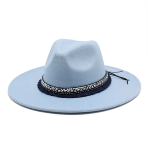 Detail view of light blue wool felt fedora with ornate woven band and fringe accents