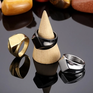 Polished geometric stainless steel signet rings in gold, silver, and black finish