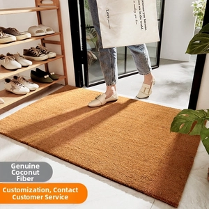 Close-up of brown natural coir doormat with durable fiber texture for mud scraping