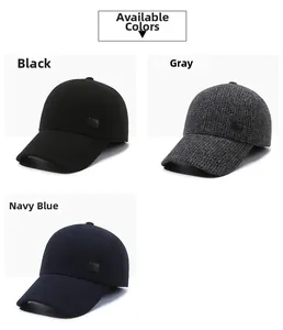 Close-up of winter baseball caps in black, grey, and navy blue with warm fabric texture