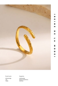 Detail of gold-plated open ring featuring a unique hammered texture and adjustable band