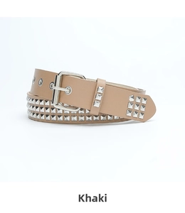 Close-up of khaki punk belt with silver pyramid studs and classic metal pin buckle detail