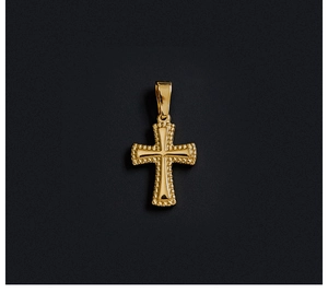 Macro shot of 18K gold plated stainless steel cross pendant with milgrain texture edge