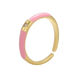 Detail of gold-plated open ring featuring pink enamel finish and round cubic zirconia