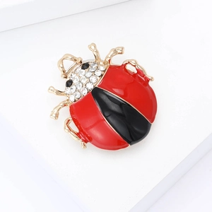 Creative enamel ladybug brooch in red and black with sparkling rhinestones on gold base