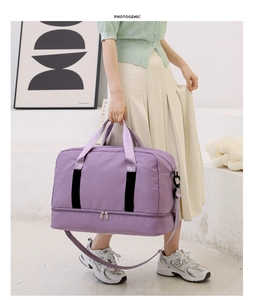 Large capacity purple travel fitness bag with dry-wet separation held by model in scene