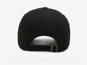 Detail view of the vintage distressed baseball cap with an antique bronze metal buckle