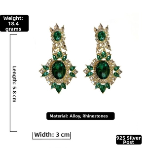 Macro detail of vintage emerald earrings showing 5.8cm length and intricate crystal setting
