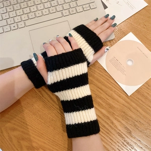 Cozy black and white striped knitted fingerless gloves for women during winter