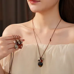 Bohemian wax cord long necklace with heart stone pendant and ethnic wood beads