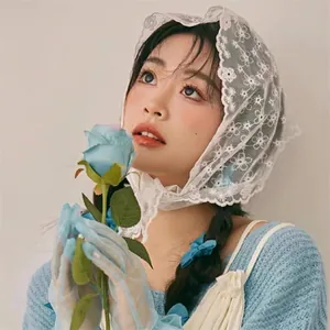 White floral lace headscarf and light blue tulle gloves set in vintage forest style