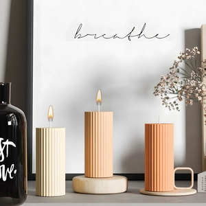 Set of three ribbed pillar candles in earthy tones for minimalist home decor