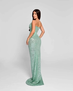 Detail of mint green sequin evening dress showing luxury texture and shimmer finish