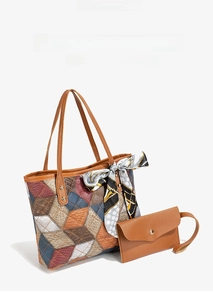 Detail of colorful argyle tote bag with silk scarf handle and matching brown clutch