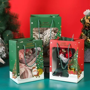 Red and green Christmas gift bags with PVC windows and festive gold stamping patterns