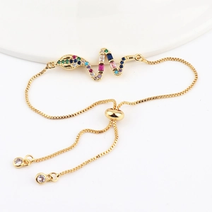 Adjustable gold snake bracelet featuring colorful cubic zirconia stones on white background