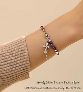Detail of bohemian stone beaded bracelet with cross pendant and marble textured beads