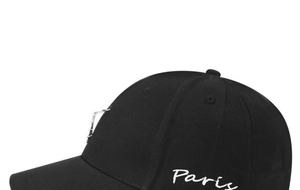 Detail of black cotton baseball cap featuring Paris embroidery and silver metal rings