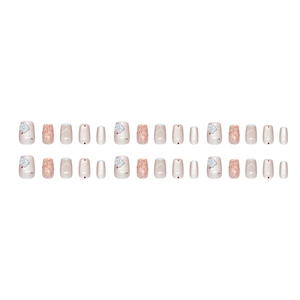 Light blue cat eye press-on nails set with 3D white flowers and sparkling rhinestones
