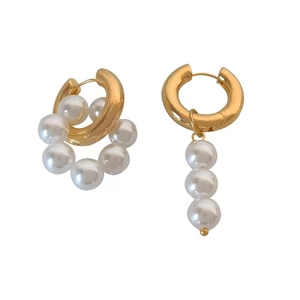 Detail of baroque freshwater pearl gold earrings in asymmetrical vintage french design
