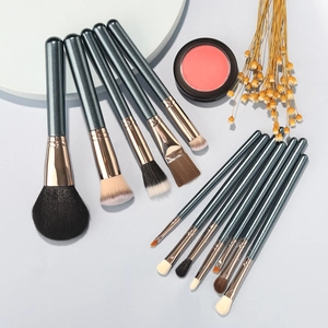 13-piece dark blue makeup brush set with rose gold tubes and synthetic bristles