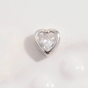 Macro view of S925 silver hollow heart bead with a clear heart-shaped zircon inlay