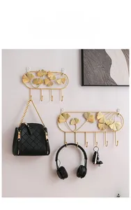 Detailed view of golden ginkgo leaf iron wall hooks with 4 and 7 hook options