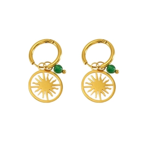Macro detail of gold plated sunburst earrings featuring a green bead and hollow sun pendant