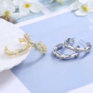 Elegant gold and silver C-shaped chain hoop earrings inlaid with sparkling cubic zirconia