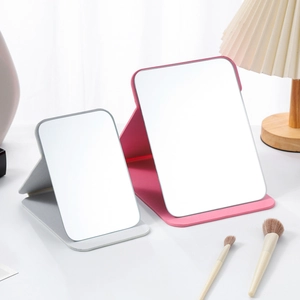 Portable folding PU leather makeup mirrors in pink and grey for tabletop vanity use