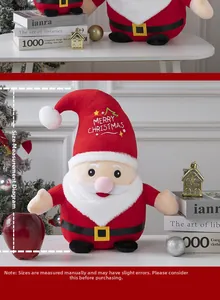 Detailed view of plush Santa doll with Merry Christmas embroidery and sizing