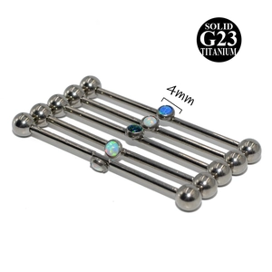 Detail view of 14G solid G23 titanium industrial barbells with 4mm opal center stones
