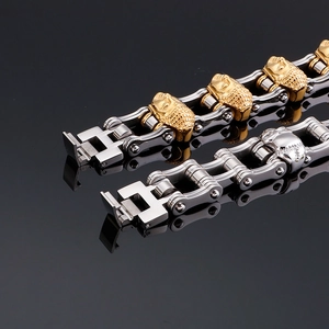 Macro detail of industrial skull buddha bracelet featuring bicolour bike chain design
