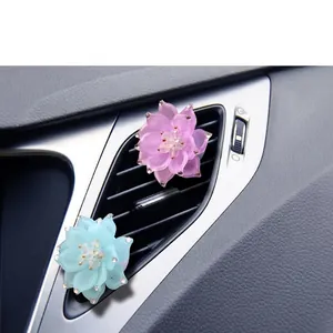 Sparkling rhinestone lotus car air vent clip diffuser in pink and blue colors