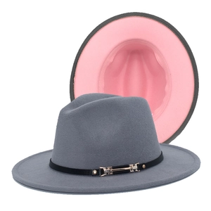 Detail view of two-tone wool felt fedora hat with grey exterior and pink interior lining