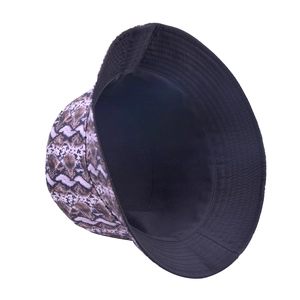 Reversible bucket hat featuring purple snakeskin pattern and solid black inner lining