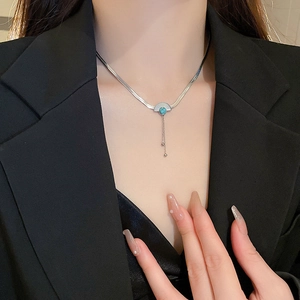 Retro stainless steel necklace with fan-shaped turquoise pendant and delicate tassels