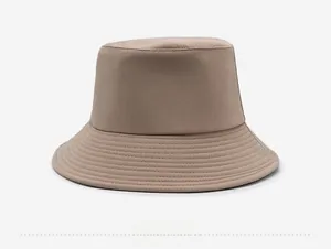 Close-up of khaki bucket hat featuring reinforced brim stitching and cotton twill texture