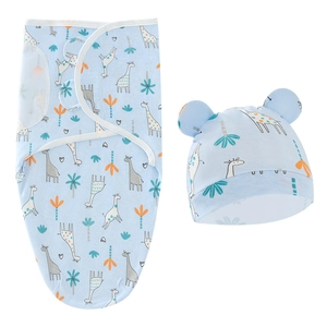 Light blue giraffe newborn swaddle and hat set made of soft cotton on white background