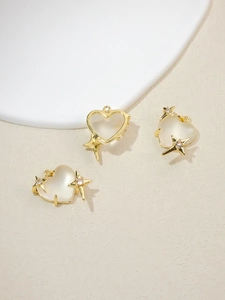 Elegant gold-plated heart pendant with milky white resin and sparkling star detail