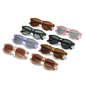 Minimalist double bridge oval sunglasses with rivets in multiple colors on white background